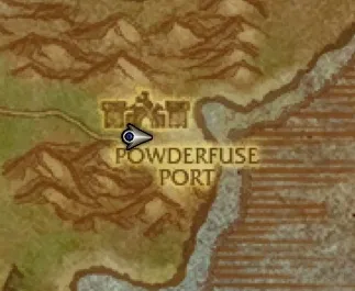 The map of The Riverglades zoomed in on Powderfuse Port, a goblin outpost on the west bank of a river, with the player arrow on it