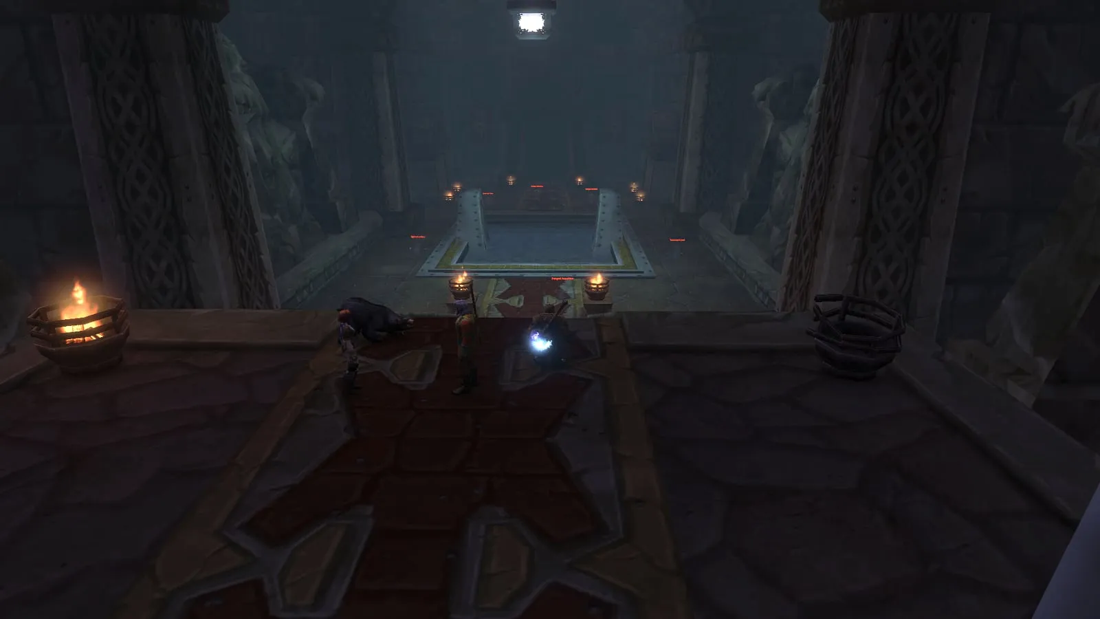 The first chamber of the Hall of Thanes, with a pool of water, candles and braziers, a screenshot from the beta of World of Warcraft: Forever