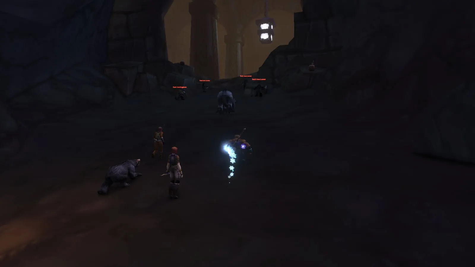 A group in a dark cavern next to kegs of Seaforium Blasting Powder, with Dark Iron Dwarves further on, a screenshot from the beta of World of Warcraft: Forever