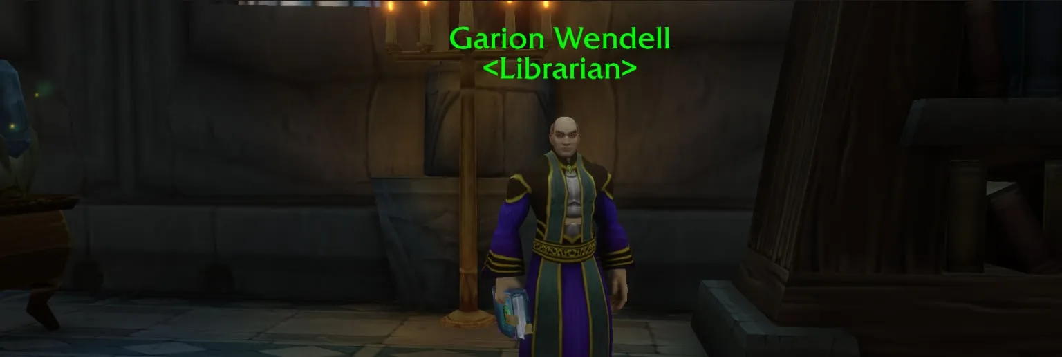 Garion Wendell, Librarian, in purple and green robes in front of a candelabrum and bookcases, a screenshot from the beta of World of Warcraft: Forever