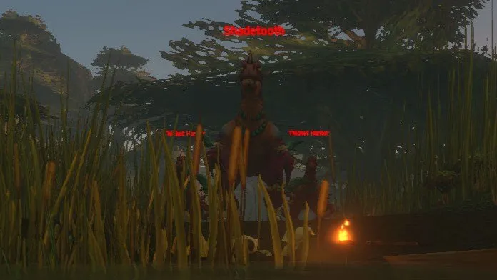 Shadetooth between two Thicket Hunters in the tall grass of the Excavation Site, a screenshot from the beta of World of Warcraft: Forever