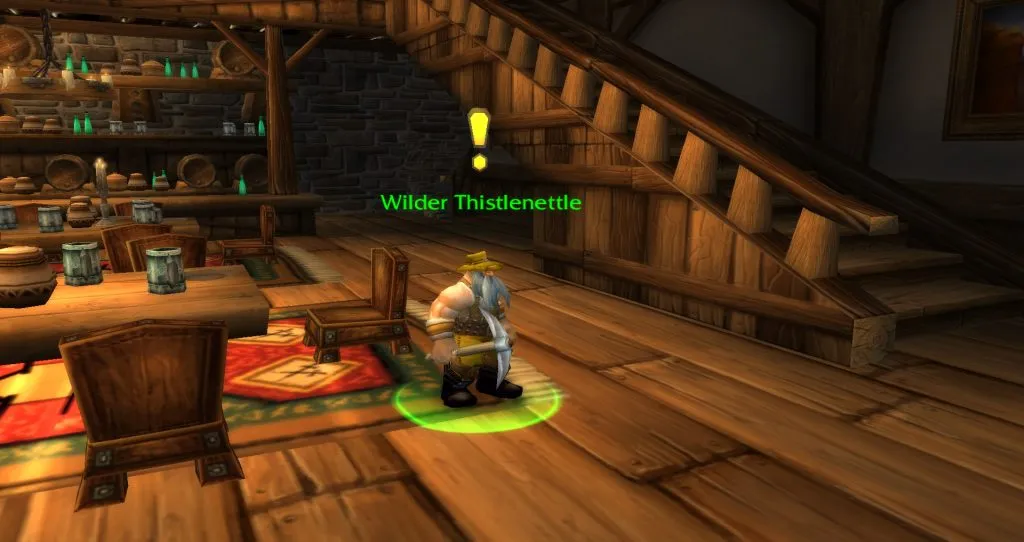 Wilder Thistlenettle with a yellow exclamation mark in a tavern in Stormwind, a screenshot from World of Warcraft