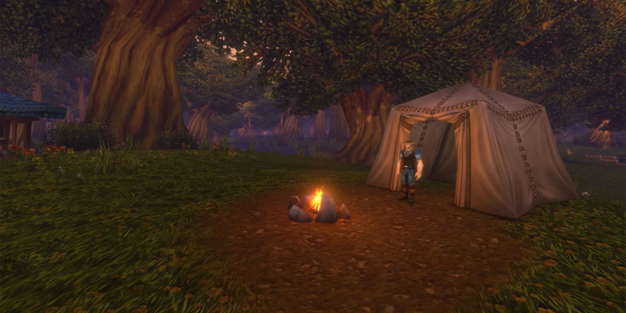 A character stands by a small campfire in front of a canvas tent under large trees at dusk, a screenshot from the beta of World of Warcraft: Forever