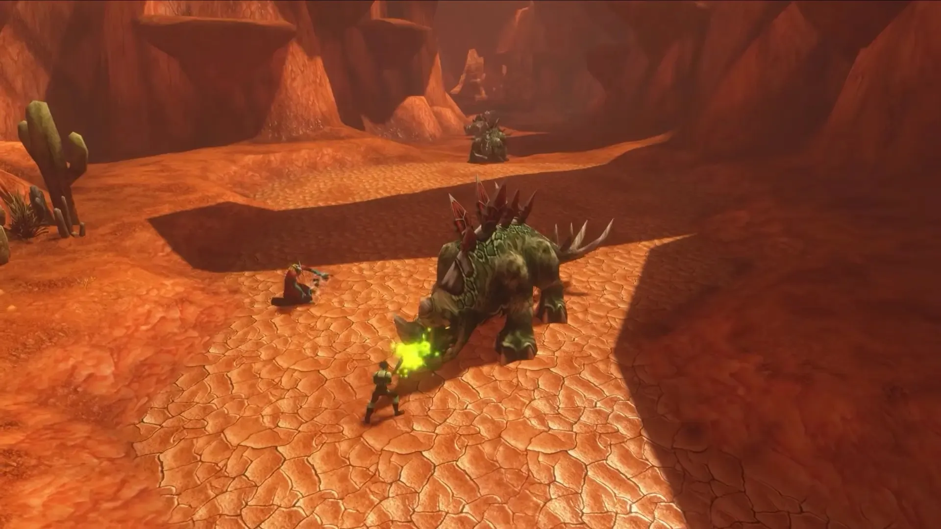 Deux joueurs combattent un grand thunder lizard dans un canyon rouge de Durotar, une capture d’écran de World of Warcraft