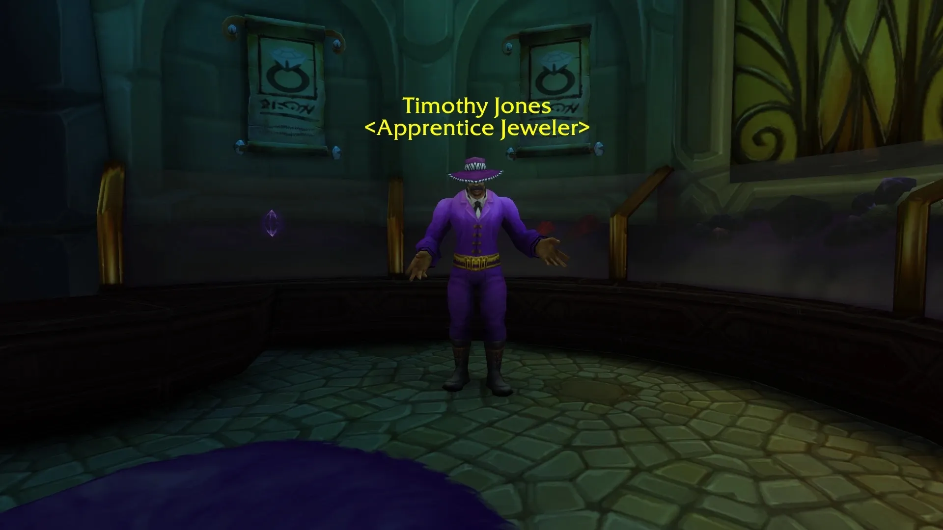 Timothy Jones, Apprentice Jeweler, in a purple suit and hat in the jewelry shop of Dalaran, a screenshot from the beta of World of Warcraft: Forever