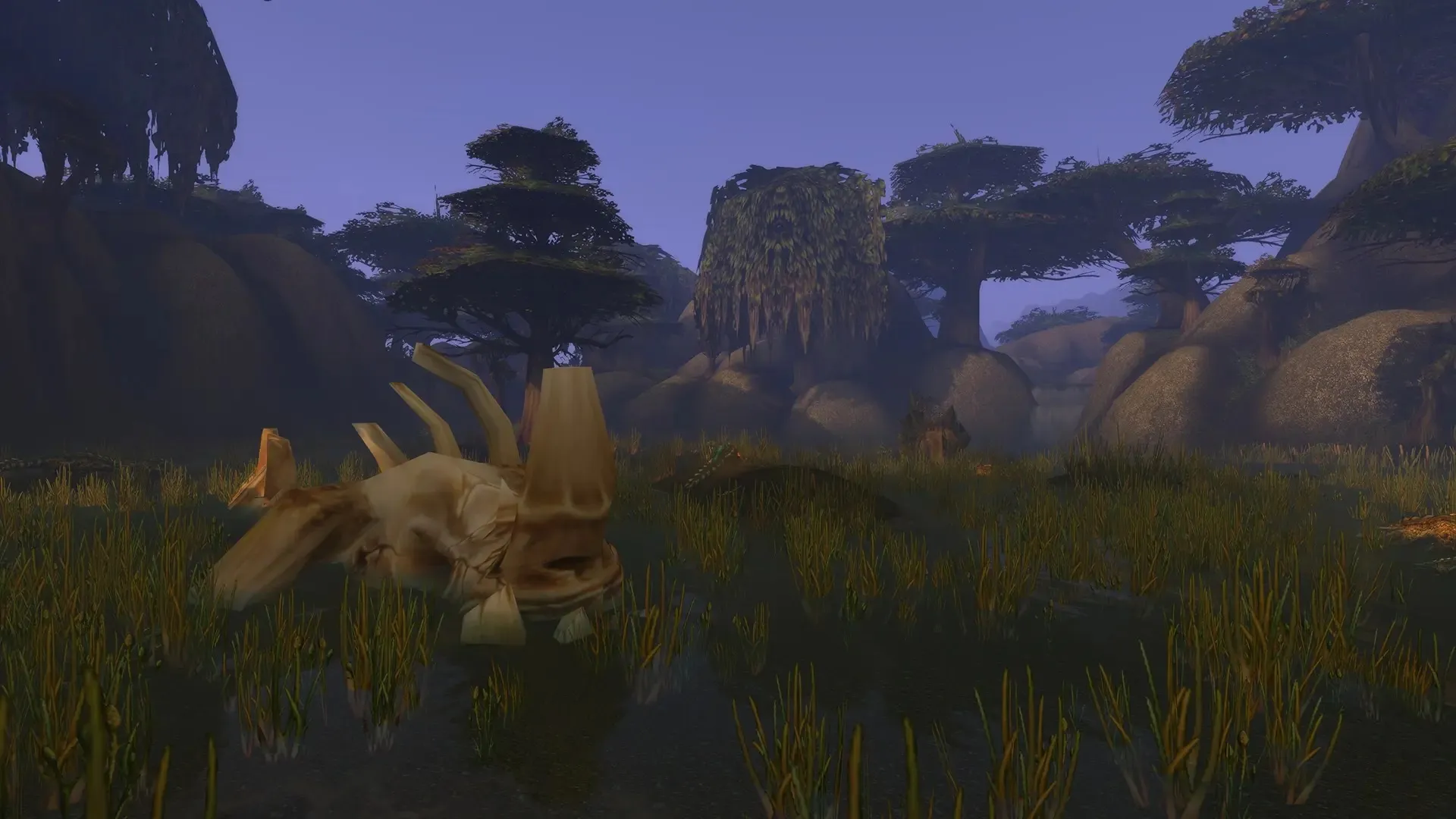 The skull of a large beast in the tall grass of a swamp under broad trees, a screenshot from the beta of World of Warcraft: Forever