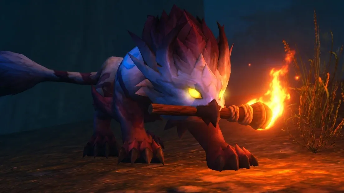 Un Druid Skyborne en Cat Form de noche con una antorcha encendida en la boca, una captura de pantalla de la beta de World of Warcraft: Forever
