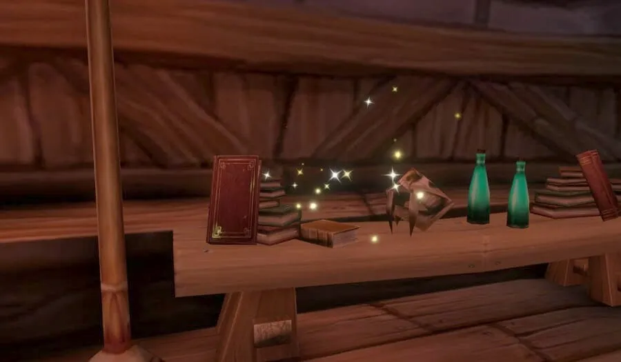 A red book on a wooden table among bottles and sparkles in the Tower of Azora in Elwynn Forest, a screenshot from the beta of World of Warcraft: Forever