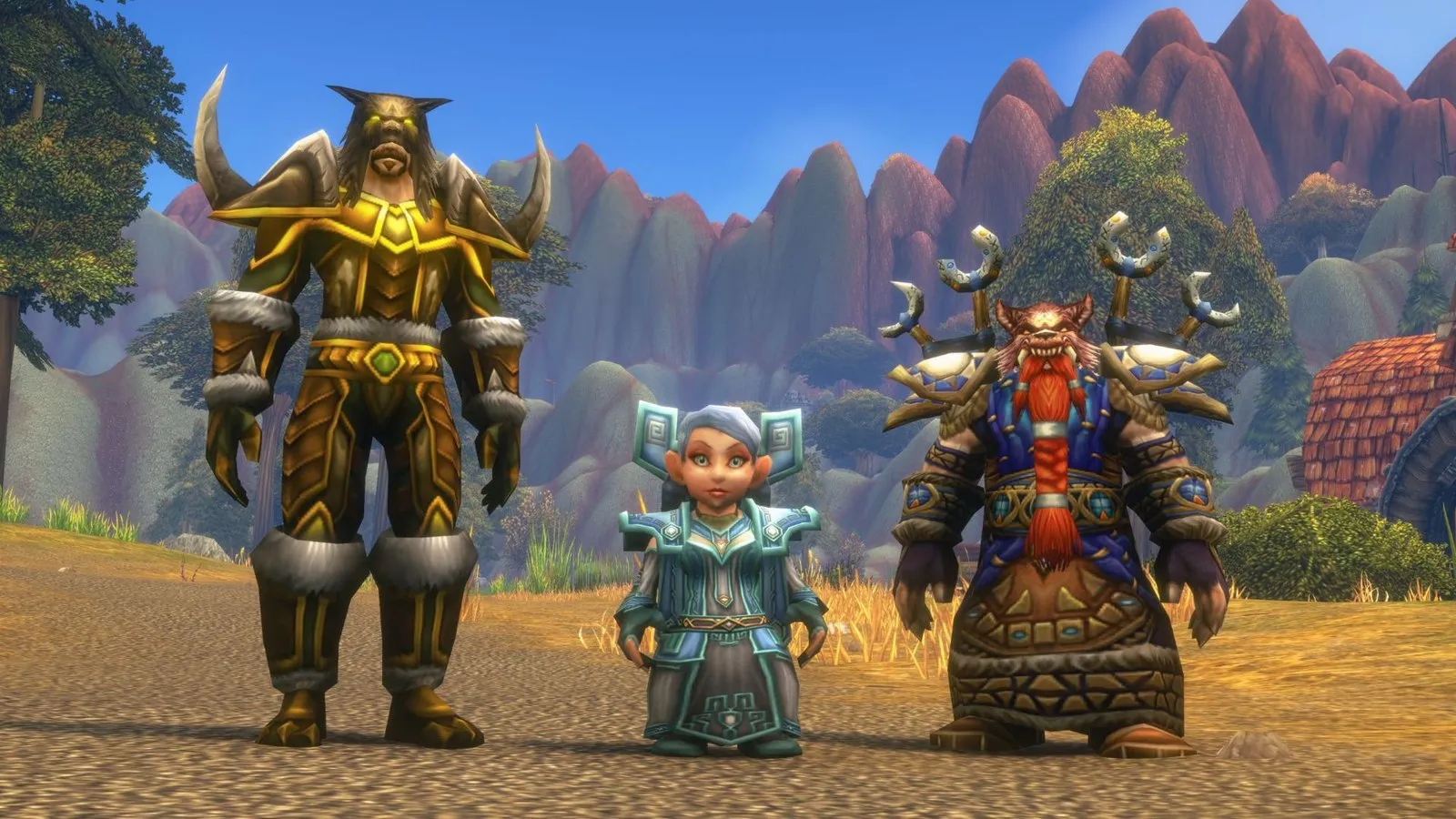 Ein Tauren, ein Gnome und ein Dwarf in passender Tier-Rüstung nebeneinander auf einer trockenen Ebene, ein Screenshot aus World of Warcraft: Forever