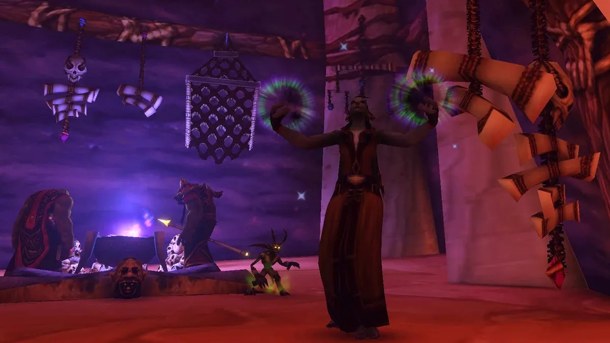 A Troll Warlock casting with green and purple fire in both hands, next to an Imp, in a red and purple hall with hanging bones and skulls