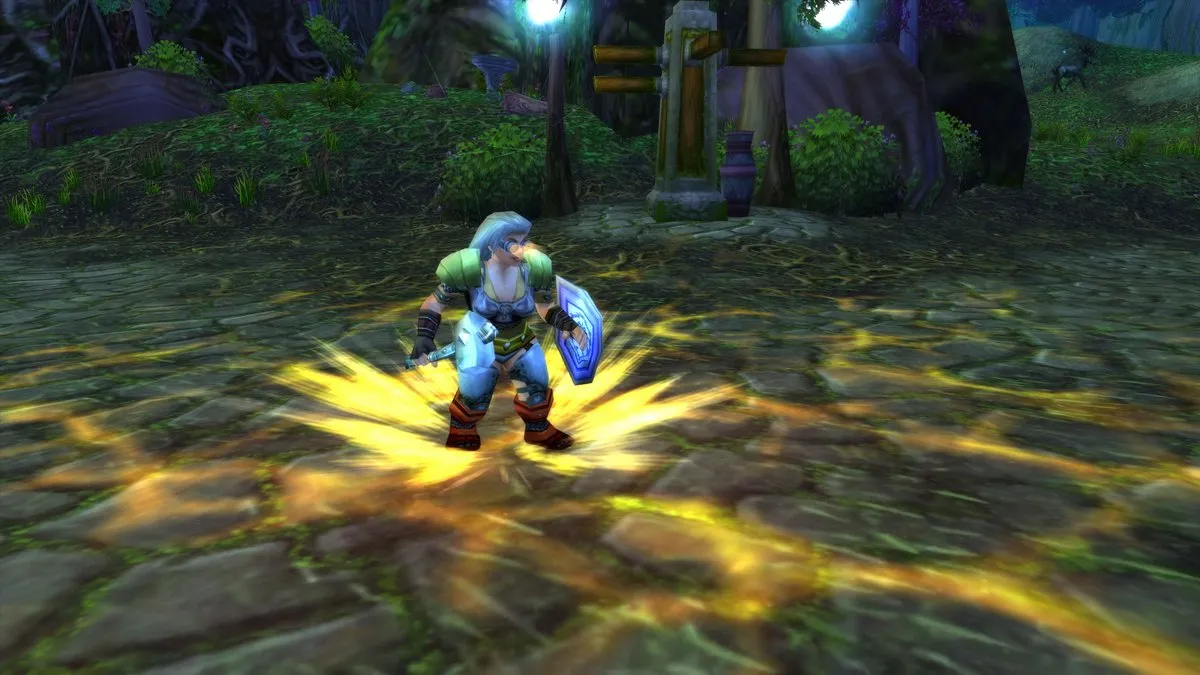 Un Paladin Dwarf avec un bouclier, entouré d’une lumière sacrée dorée sur un chemin pavé