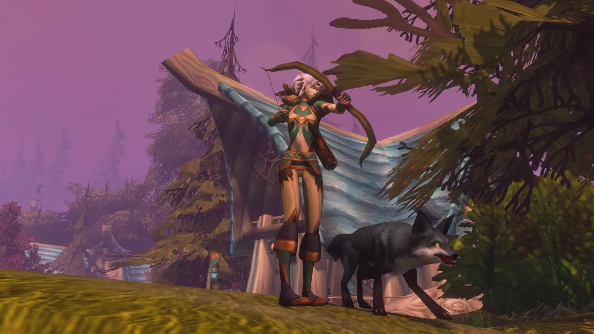A Night Elf Hunter with a bow and a dark wolf on a hill in front of a Night Elf house, a screenshot from the beta of World of Warcraft: Forever
