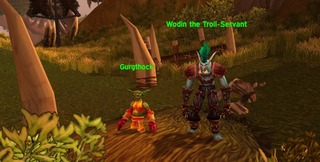 The goblin Gurgthock and Wodin the Troll-Servant next to the Ring of Blood in Nagrand, a screenshot from The Burning Crusade