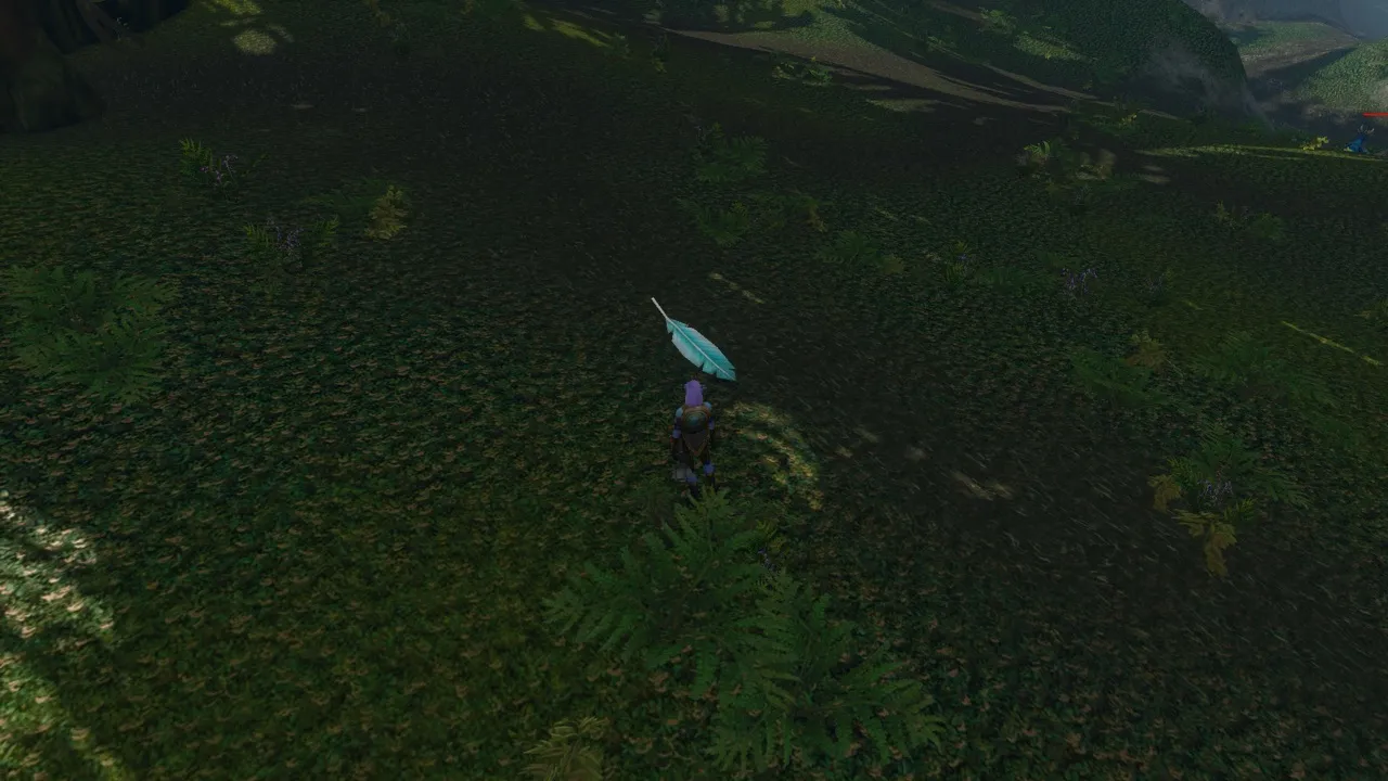 A blue Hippogryph Down feather on the ground, a screenshot from the World of Warcraft: Forever beta