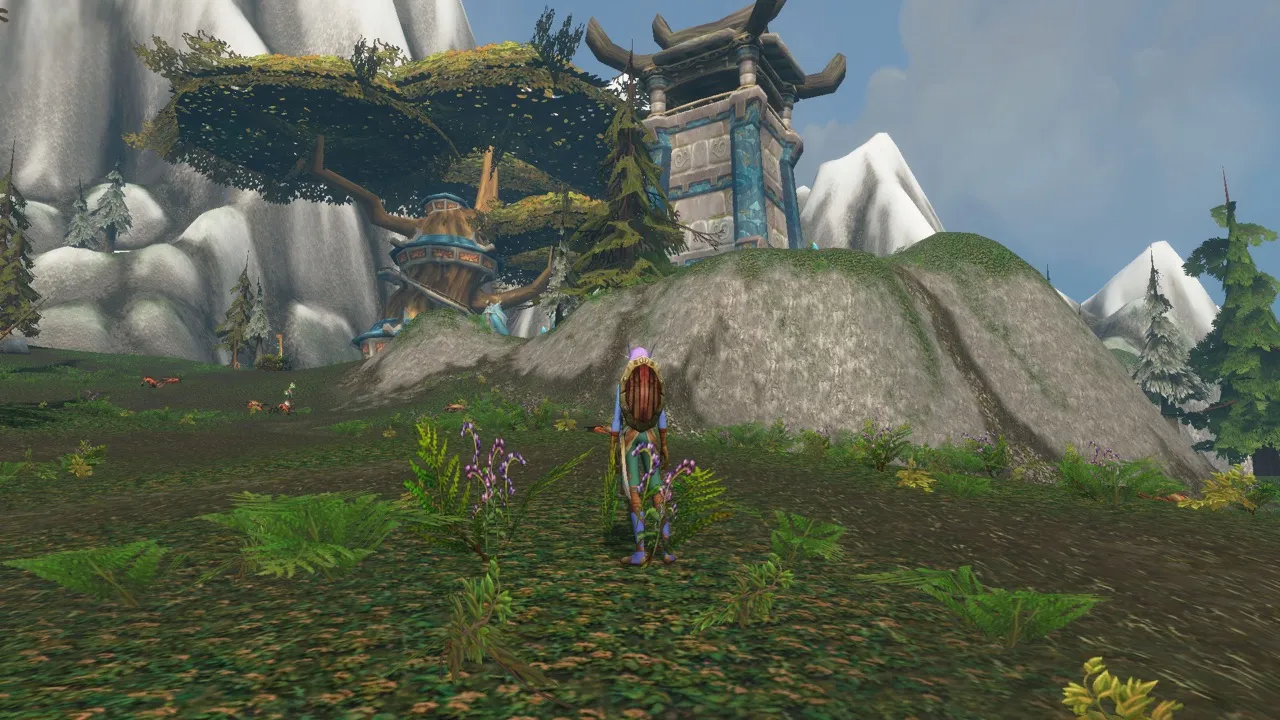 Thendal Village with a tree house and a stone watchtower on a hill, a screenshot from the World of Warcraft: Forever beta