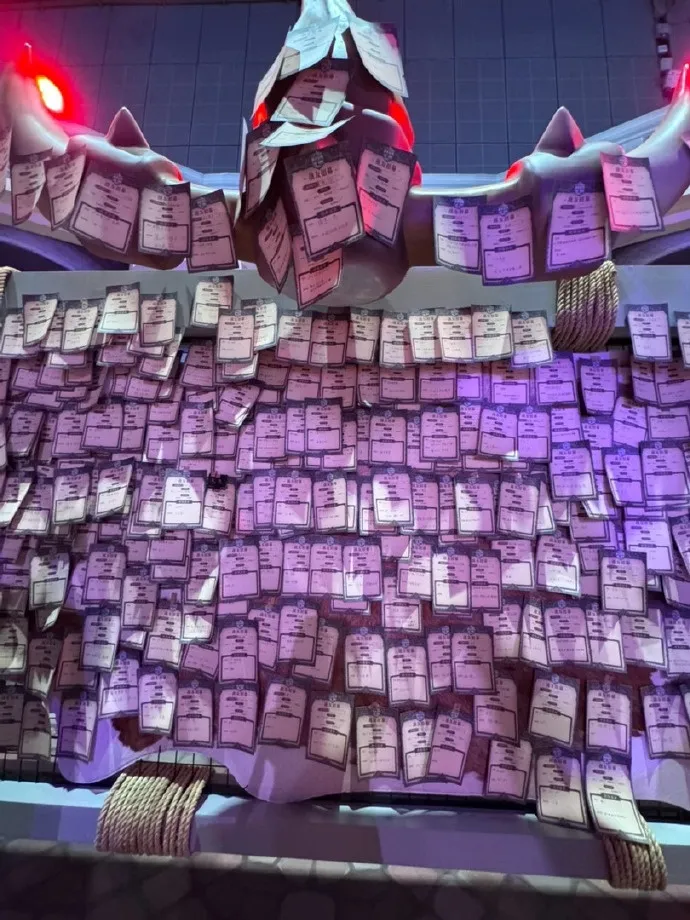 A wall covered with hundreds of small paper cards under a spiked decoration, a photo of the Forever Party in Shanghai